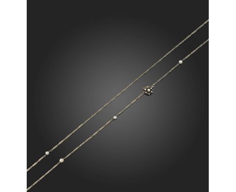 A pearl longchain, early 20th century, composed of hayseed linking in white gold, threaded with pearls, to a floral clasp in 