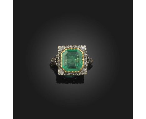 An emerald and diamond cluster ring, set with an emerald-cut emerald within gold collet and square-shaped diamond surround, f