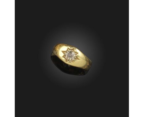 A brown diamond ring, circa 1876, the tapering 18ct gold band claw-set with a circular-cut diamond of light brown tint weighi
