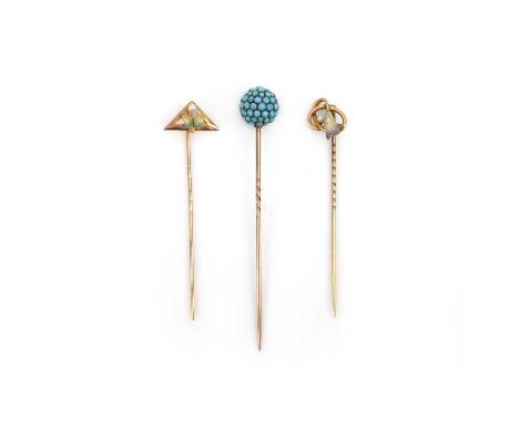 Three stick pins, circa 1900, comprising: one pin capped with a spherical bead pavé-set with turquoise cabochons, length 7.3c