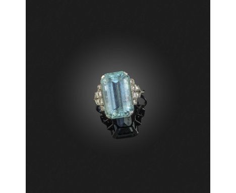 An aquamarine and diamond ring, early 20th century, claw-set with a step-cut aquamarine, to geometric shoulders set with sing