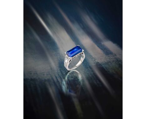 Boucheron, a sapphire and diamond ring, set with a baguette-shaped sapphire weighing 4.969 carats, within tapered baguette-sh