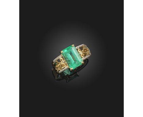 An emerald ring, claw-set with a step-cut emerald stated to weigh 3.42 carats, to a bicoloured 18ct gold mount, size N, Briti