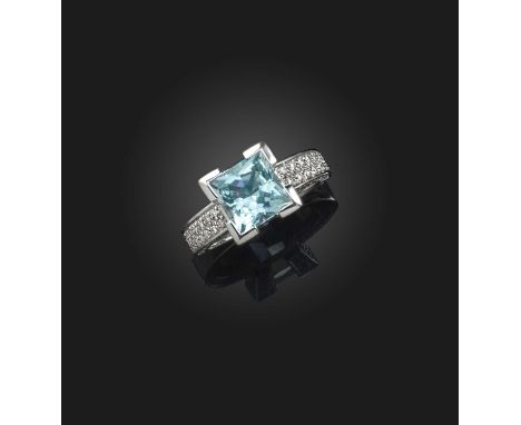 An aquamarine and diamond ring, set with a square aquamarine, to claws and shoulders pavé-set with brilliant-cut diamonds, mo