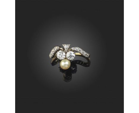 A late 19th century pearl and diamond ring, designed as a stylised shamrock set with a pearl and two diamonds on an arced dia