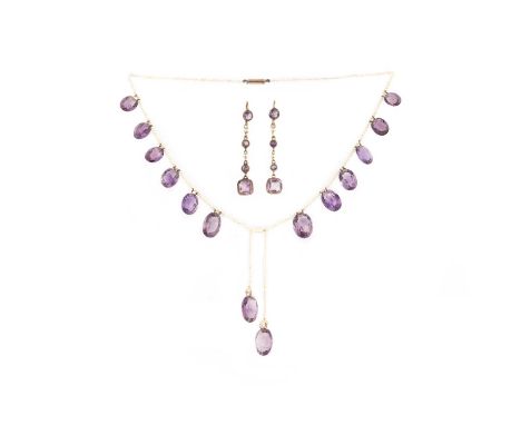 An amethyst and seed pearl necklace and pair of earrings, comprising: a necklace of seed pearls, suspending a fringe of oval 