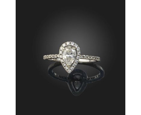 A pear-shaped diamond cluster ring, set with a pear-shaped diamond within a halo of round brilliant-cut diamonds and diamond 