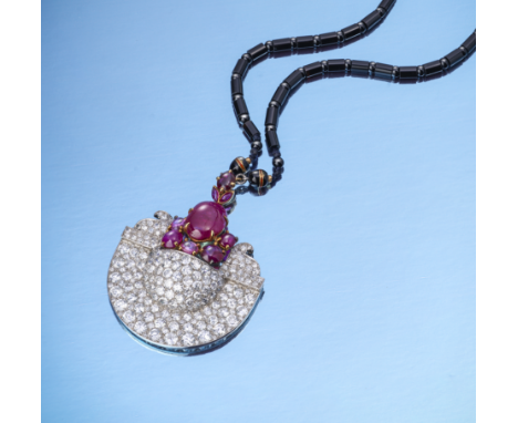 Cartier, an extremely rare Art Deco Egyptian Revival ruby and diamond necklace, 1920s, composed of a U-shaped pendant with st