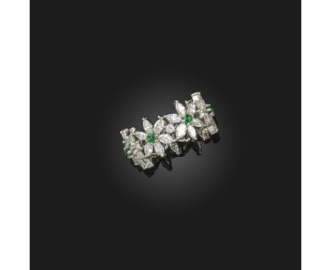 An emerald and diamond full circle eternity ring, designed as diamond-set flowerheads, each centring on a circular-cut emeral