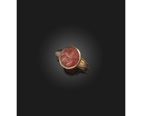 A carnelian intaglio ring, Sassanian, circa 400 AD and later, set with an oval carnelian intaglio depicting a winged bull wit