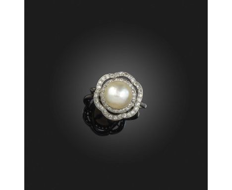 An early 20th century natural pearl and diamond cluster ring, the pearl set within surrounds of single-cut diamonds in platin