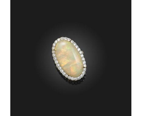 An opal and diamond ring, set with a cabochon opal measuring 27 x 15 x 9mm, within a border of brilliant-cut diamonds, mounte