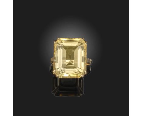 A citrine ring, mid 20th century, set with a step-cut citrine, mounted in gold, size J1/2, stamped 9ct