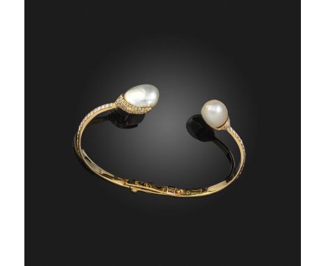 A natural pearl and diamond bangle, designed as a torque of hinged construction, each end set with a natural pearl, one inlai