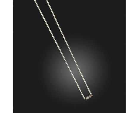 A natural pearl and diamond necklace, early 20th century, designed as a single long strand of natural pearls measuring approx