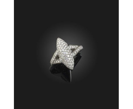 Picchiotti, a diamond ring, centring on a domed navette-shaped motif, to split shoulders, pavé-set with brilliant-cut diamond
