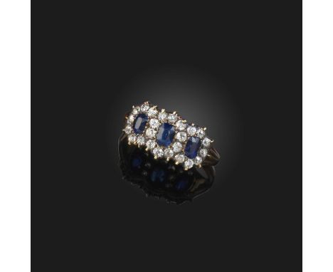 A sapphire and diamond ring, late 19th century, designed as a triple cluster, set with cushion-shaped sapphires and diamonds,