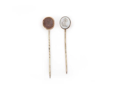 Two hardstone stick pins, one set with an octagonal chalcedony intaglio depicting Minerva, the other with a banded white agat