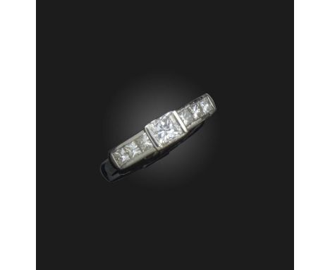 A diamond ring, centring on a princess-cut diamond, to shoulders channel-set with lines of smaller princess-cut diamonds, mou