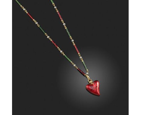 A late 19th century enamel pendant and chain, the witches heart pendant decorated with red guilloche enamel, suspending on a 