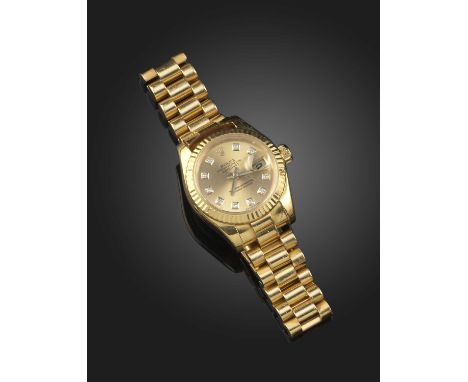 Rolex, a lady's gold Datejust wristwatch, model 69173, case number 5926189, signed champagne dial with diamond hour markers, 