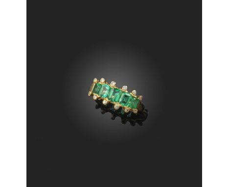 An emerald and diamond ring, set with a sequence of five step-cut emeralds, the outer borders with collet-set brilliant-cut d