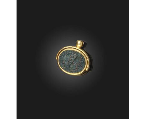 An unsual hardstone spinning fob seal locket, 19th century, the spinning fob seal set to one side with a bloodstone intaglio 