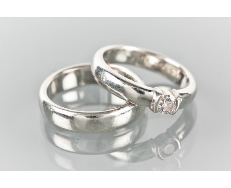 TIFFANY & CO ENGAGEMENT AND WEDDING RING SET
the engagement ring with a brilliant cut diamond measuring 0.21 carats, in plati