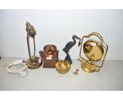 Mixed lot of metal wares comprising a small brass table gong, a table lamp, coffee grinder, model heron and other assorted sm