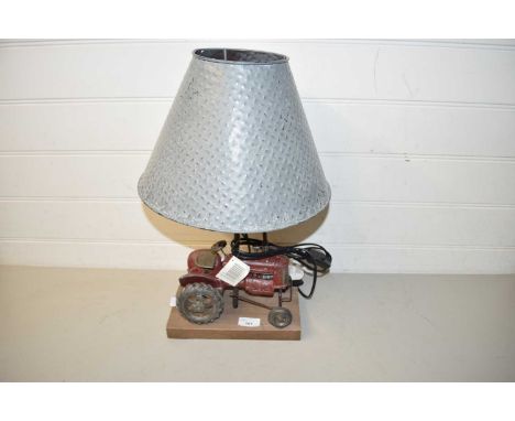 Modern table lamp, the base formed as a tractor