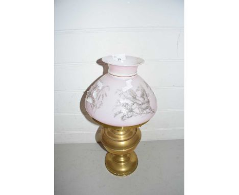 Brass oil lamp, the pink shade decorated with prints of birds