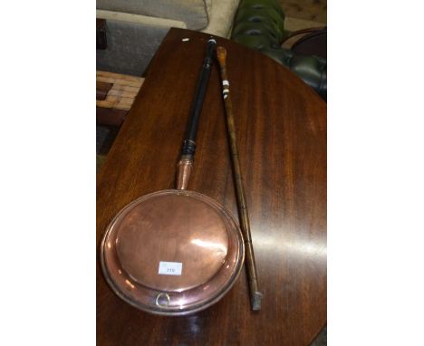 Copper bed warming pan and a walking stick