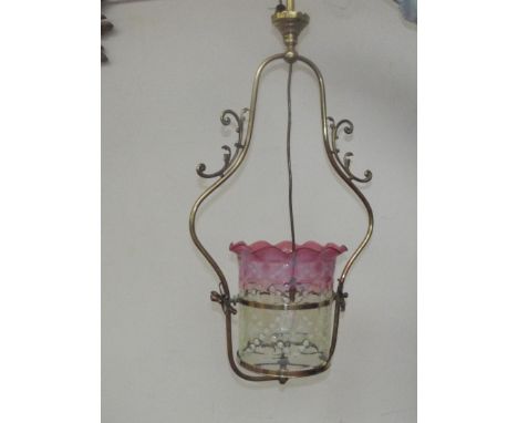 A Victorian hanging lamp with green and pink glass shade, brass fittings. 93cm high. 