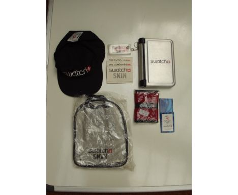 Swatch watch - Swatch accessories, 10 items ( 2 small notebooks, 1 wallet, 1 cap, 1 organizer, 3 packet of plaster, 1 keyring