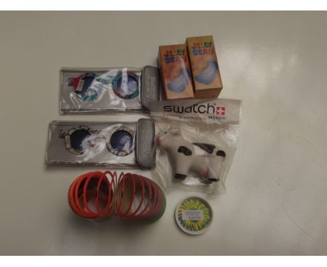 Swatch watch - Swatch accessories, 6 items (2 jelly bean torches, 2 sun glasses, 1 squeezy cow and 1 slinky)