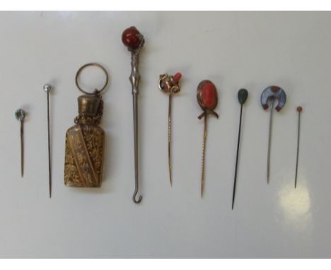 Collection of Victorian jewellery, metal hat pins (some yellow metal and coral), mourning brooch, button hook, scent bottle