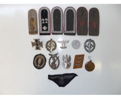 Collection of Nazi insignia comprising 1914 first class Iron Cross with screw back (good and in unclean condition), 1939 firs