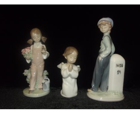 Three lladro figures comprising the wanderer , spring girl and angel praying