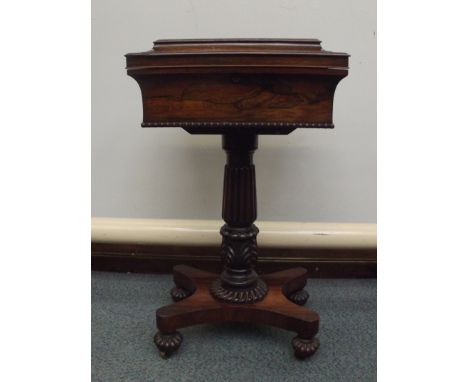 William IV rosewood teapoy, reeded and carved pedestal, four caddy interior and two compartments for mixing bowls (missing), 