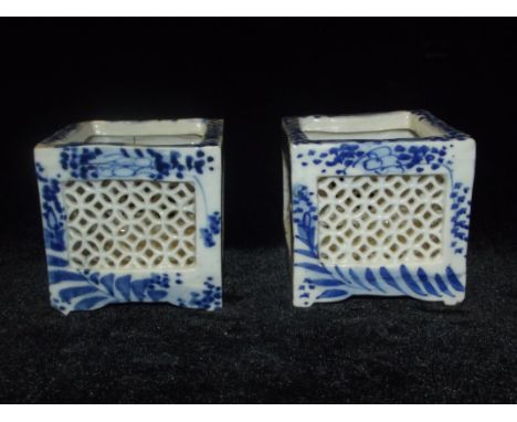 Pair of early 20th century Chinese blue and white ceramic cricket cages, height 7cm