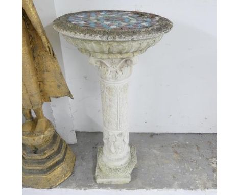 A weathered concrete two-section pedestal, with mosaic top. 42x80cm. A/F.Crack to top section, and damage to base. The mosaic