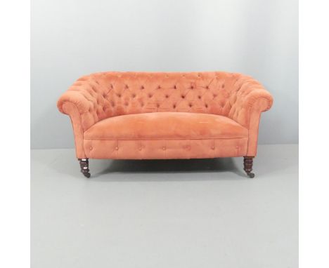 A Victorian style mahogany and button-back upholstered two-seater sofa. Overall 140x69x69cm, seat 97x40x46cm. 