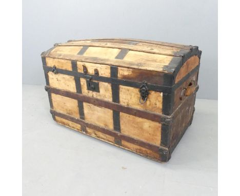 A 19th century pine dome top trunk, with metal and oak binding. 88x60x51cm. 