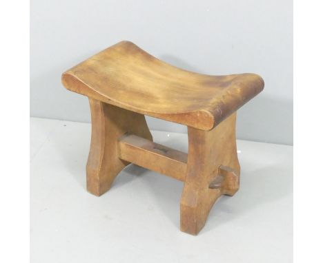 An Arts & Crafts teak stool by R B Richards & Sons, Castle Foregate Saw Mills, Shrewsbury, with maker's metal plaque. 47x39x2