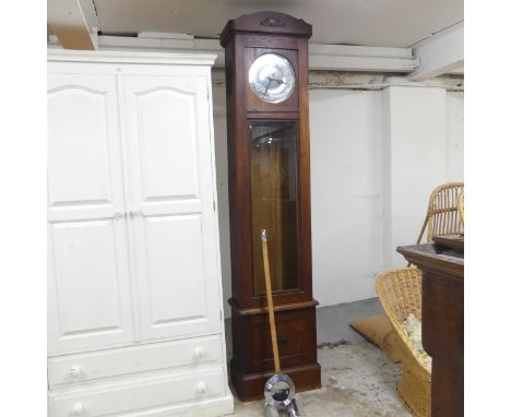 An Art Deco oak-cased longcase clock, with two weights and pendulum. 47x210x27cm.
