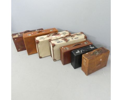 Seven various suitcases, including two with MOD arrow marks dated 1982. Largest 72x20x41cm. 