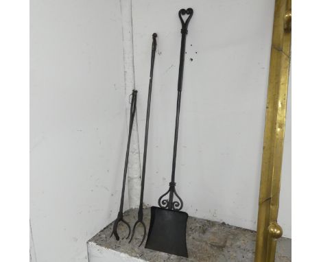 A set of wrought iron fire tools. Longest 120cm. 