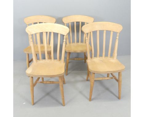 A set of four modern beech stick-back dining chairs. 