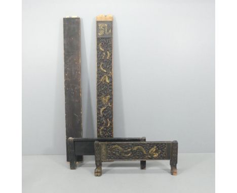 A Chinese black and gold painted daybed frame, with carved dragon decoration. Overall size approximately 92x183cm. A/F.Only o