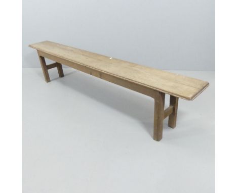 A rustic oak bench. 205x44x26cmScrew repairs to both legs. Some worm damage. Marks, scratches and loss particularly to feet. 
